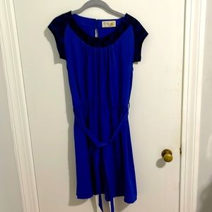 Late, blue dress with floral black lace.